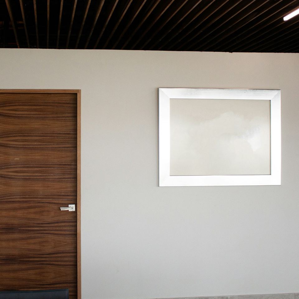 Two walnut-finish internal doors in a white hallway
