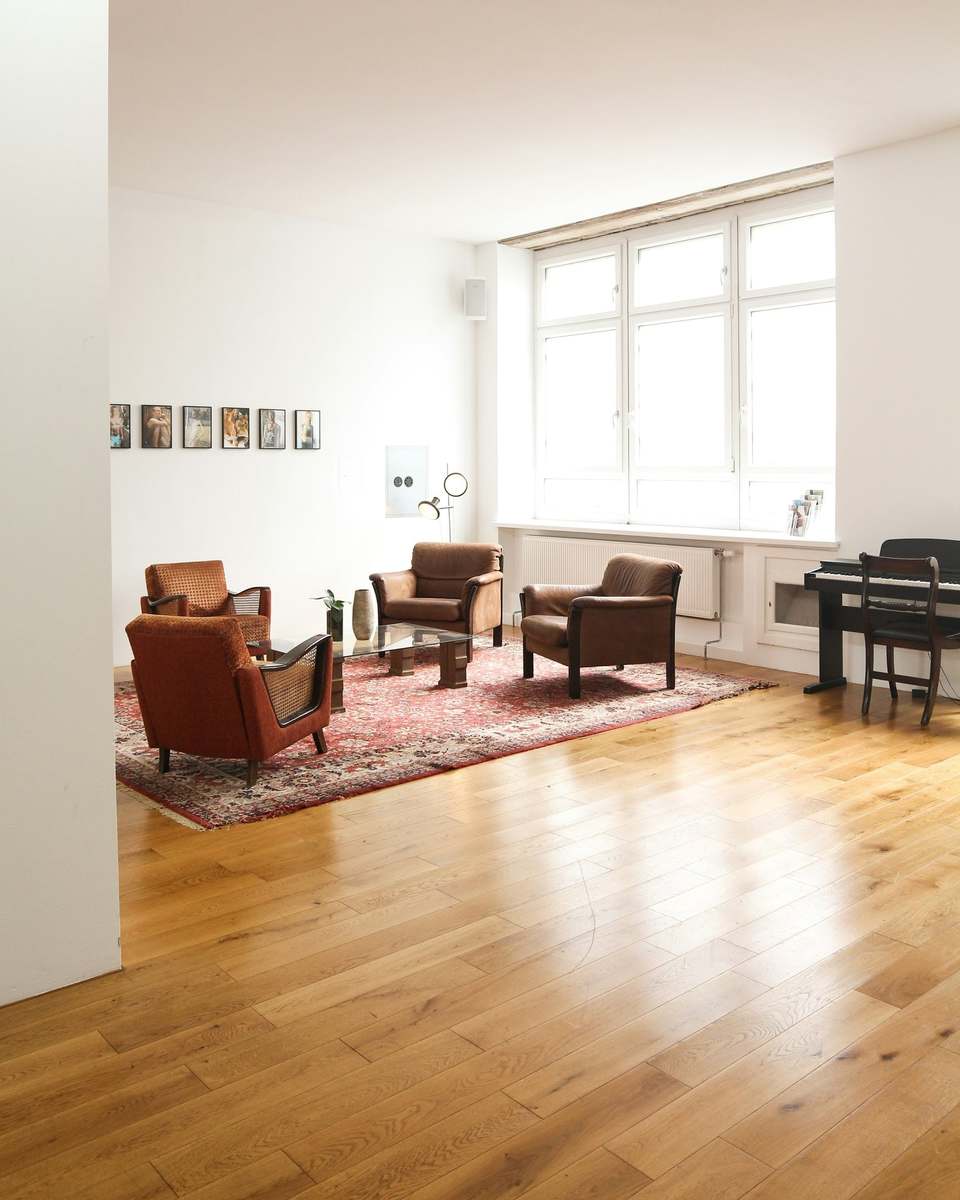 Oak floorboards across a bright living room
